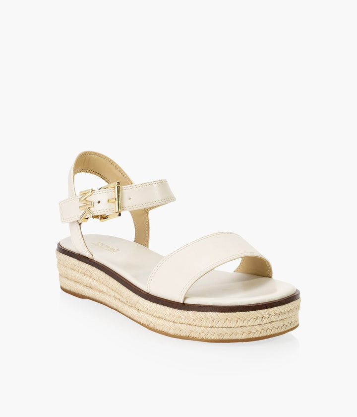 Front angled view of Michael Kors Richie Espadrille Light Cream Sandal - Omars Shoes, MK Collection